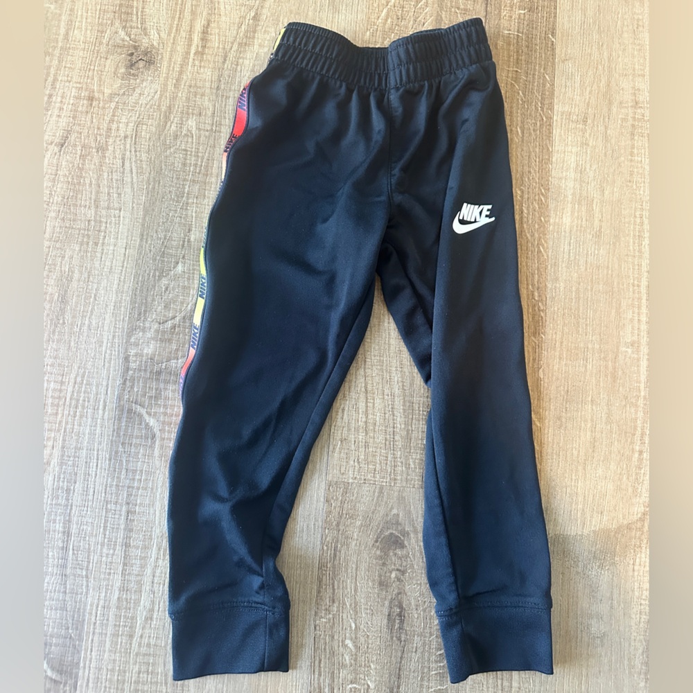 Nike Boys size 4 Black Joggers with Multicolor Stripe‎
